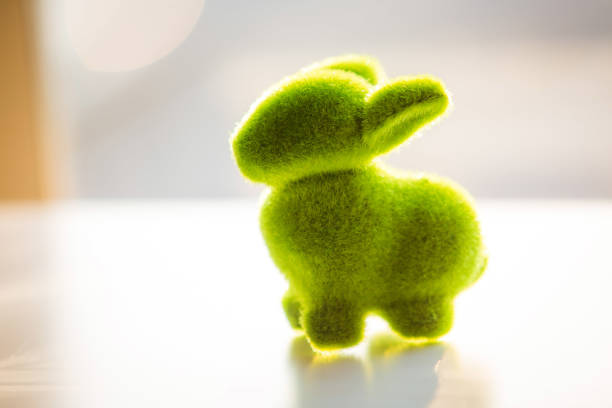 Grass bunny toy as symbol of spring and Easter alone