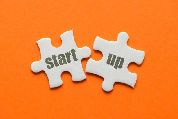 istock The word start up on two matching puzzle on orange background 946873506
