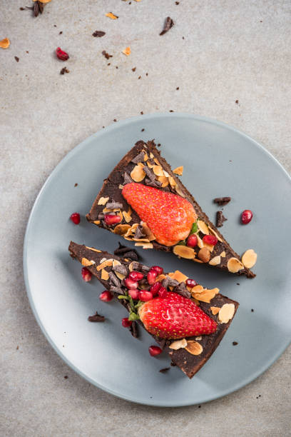 istock Serving chocolate brownie cake on plate 946877702