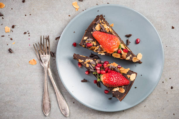 istock Serving chocolate brownie cake on plate 946877818