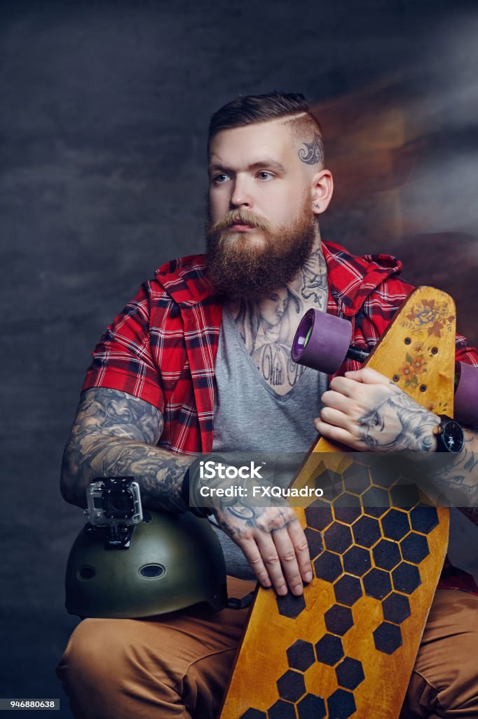 Bearded Tattooed Man In Red Shirt Holding Long Board Stock Photo - Download  Image Now - iStock
