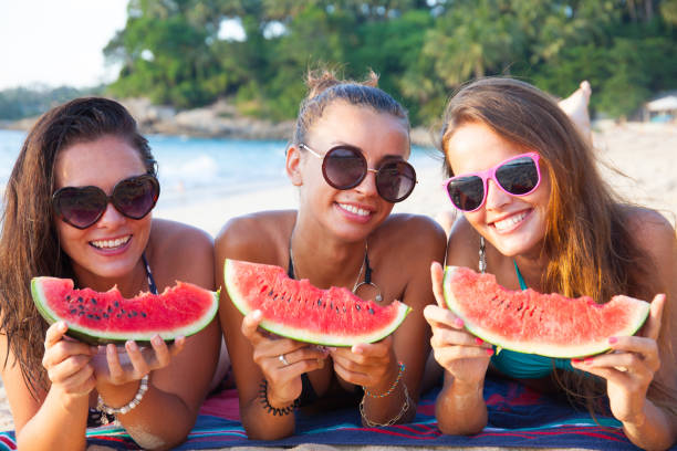 istock Female friends eating watermelon 946880926