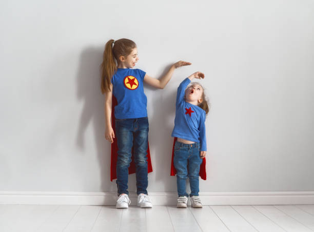 istock children are playing superhero 946884970