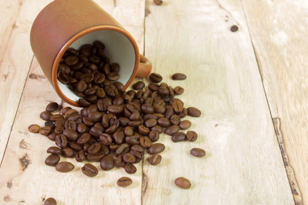 istock coffee beans and cup on the wooden table 946885276