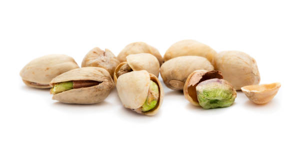 istock heap of pistachio isolated on white background 946904662