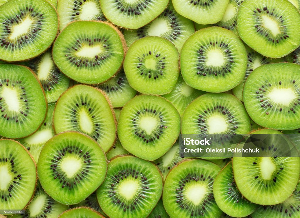 sliced kiwi as textured background heap of sliced ripe kiwi as textured background Kiwi Fruit Stock Photo