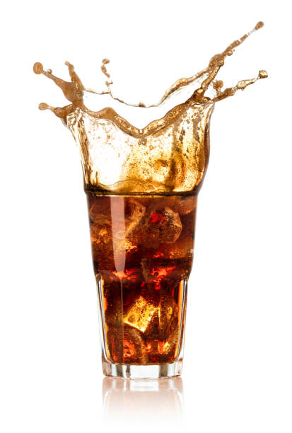 istock glass of cola with splash isolated on white 946905406