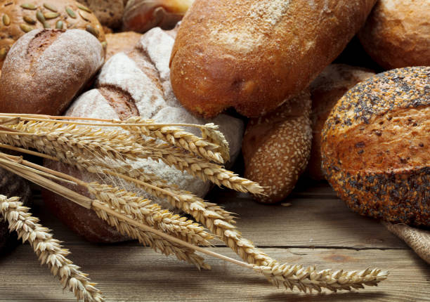 istock heap of various bread on wooden background 946905778