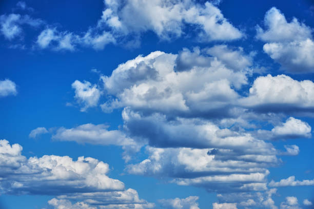 istock Summer day. Beautiful cumulus clouds in a blue sky. Background 946905804