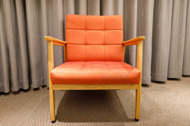 istock An orange sofa chair in the room 946913598