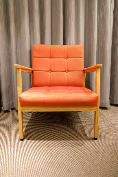 istock An orange sofa chair in the room 946913626