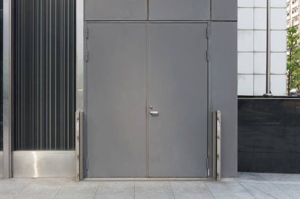 istock sidewalk by street wall & door 946916096