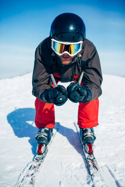 istock Skier racing from the mountain, front view 946916354