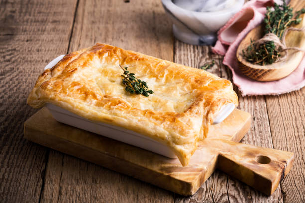 Chicken pot pie with vegetables and aromatic herbs Chicken pot pie with vegetables and aromatic herbs on wooden table.  Traditional american meal in rustic style easter cake photos stock pictures, royalty-free photos & images