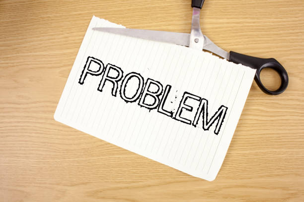 istock Conceptual hand writing showing Problem. Business photo text Trouble that need to be solved Difficult Situation Complication written on Tear Notebook Paper on wooden background Scissor. 946923456