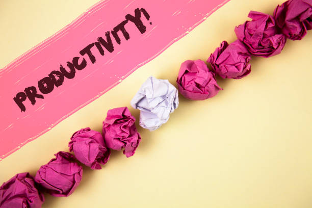 istock Handwriting text writing Productivity Motivational Call. Concept meaning Effective work Great perfomance Success focus written on Painted background Crumpled Paper Balls Line next to it. 946924028