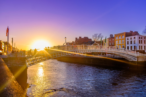 Ha'penny Bridge over the river Liffey at sunset, Dublin, Ireland, March 2018