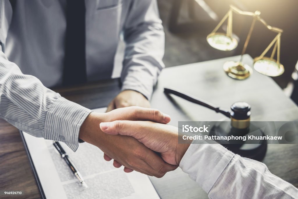 Handshake after good cooperation, Businessman handshake male lawyer after discussing good deal of Trading contract and new projects for the company of real estate, Meeting and greeting concept Handshake after good cooperation, Businessman handshake male lawyer after discussing good deal of Trading contract and new projects for the company of real estate, Meeting and greeting concept. Lawyer Stock Photo