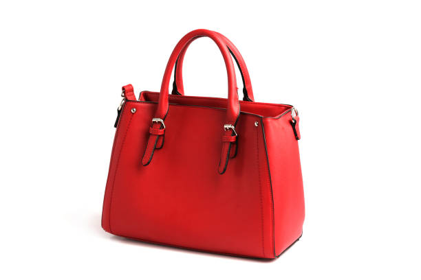 istock Red elegant female bag with two handles on white background 946927252