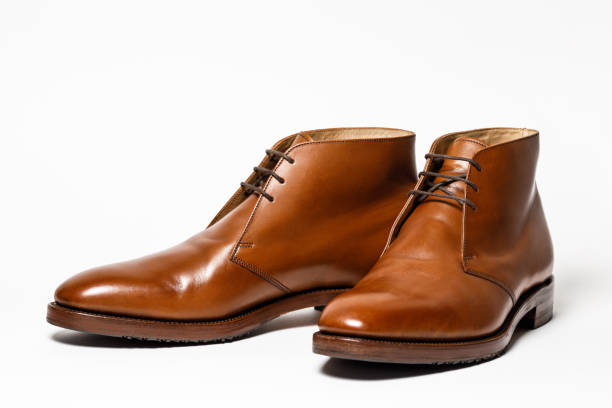 istock Men's classic brown leather shoes isolated on white background 946928070