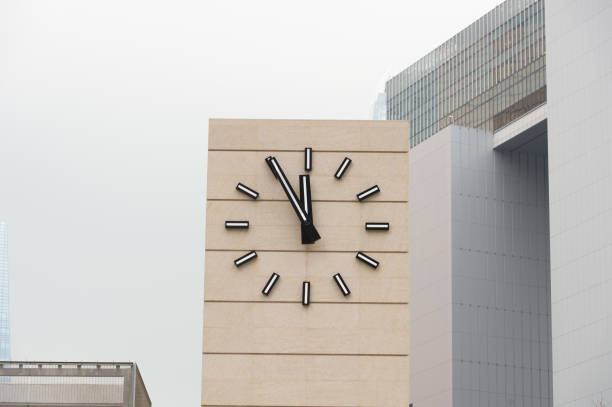 round  clock on a pillar on the boulevard