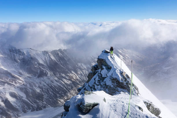 istock Mountain Climber at the long way to Grossglockner, Austrian Alps 946932132