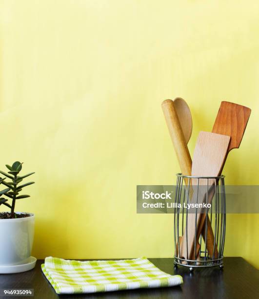 https://media.istockphoto.com/id/946935094/photo/kitchen-utensils-and-house-plant-on-dark-shelf-over-yellow-wall-kitchen-interior-background.jpg?s=612x612&w=is&k=20&c=vekz7prpMD4WBUItZ25iJ_zu2OgaOQnKinx42FrZARQ=