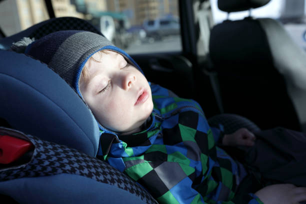 istock Child sleeping in car seat 946935246