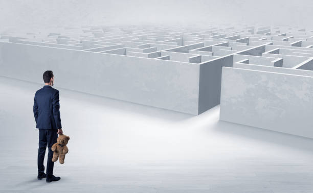 istock Businessman starting a labyrinth challenge 946938612