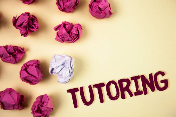 istock Writing note showing  Tutoring. Business photo showcasing Mentoring Teaching Instructing Preparing Supporting Give lessons written on Plain background Crumpled Paper Balls next to it. 946938932