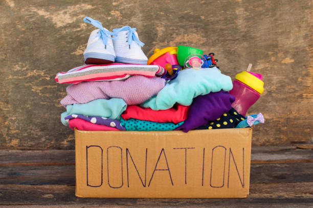 Donation box with children's things and toys Donation box with children's things and toys belongings photos stock pictures, royalty-free photos & images