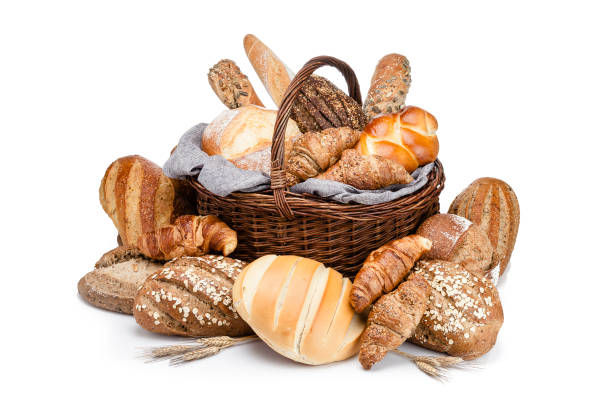 istock Bread in a wicker basket isolated on white background 946939112