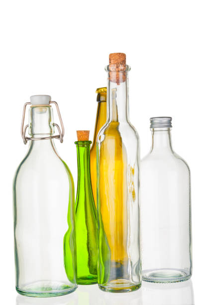 istock Empty glass bottles closeup on white background 946941870