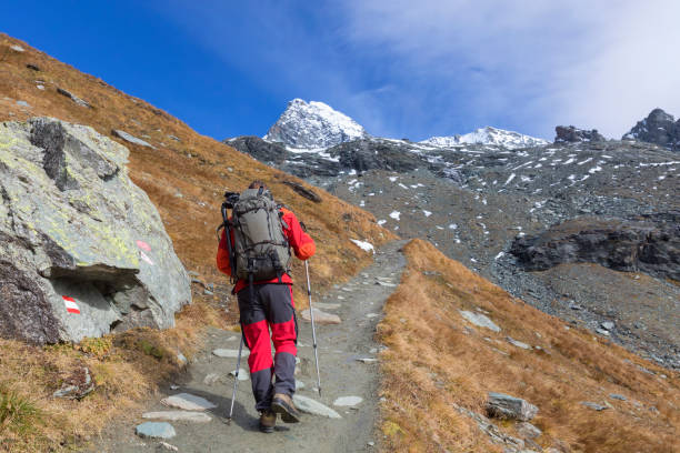 istock Mountain Climber at the long way to Grossglockner, Austrian Alps 946945806