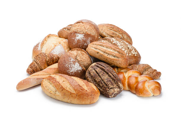 istock Loaf of bread heap shot on white background 946949446