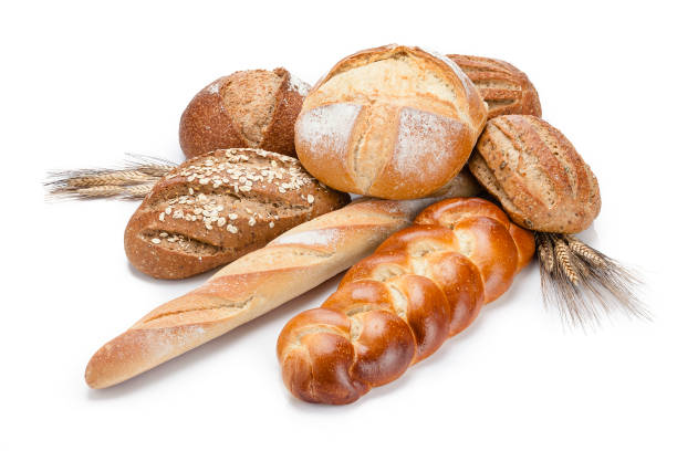 istock Loaf of bread heap shot on white background 946949458
