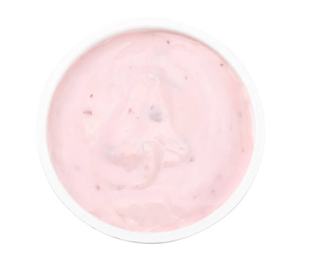 istock Healthy raspberries yogurt isolated on white background. Top view. 946952504