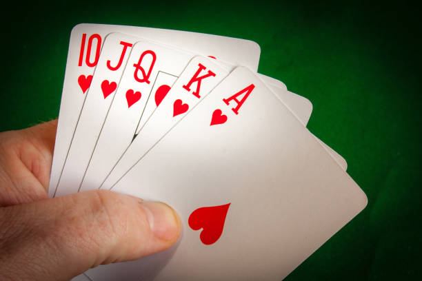 istock Poker player holding a royal flush 946957538