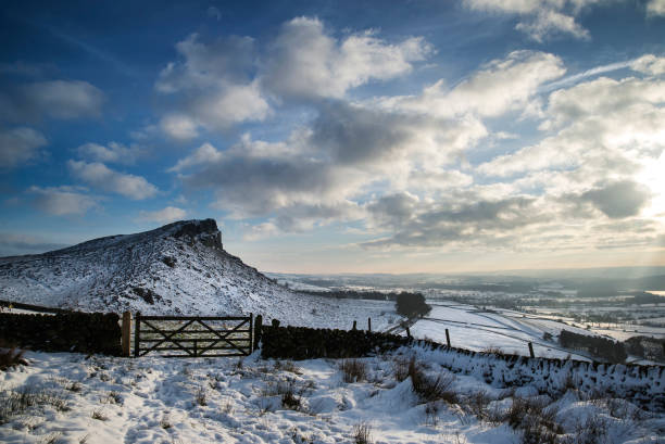 istock Stunning Winter sunset over snow covered Winter landscape in Peak District 946958076