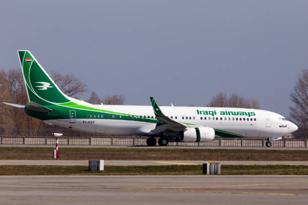 YI-AST Iraqi Airways Boeing 737-800 aircraft landing on the runway stock photo