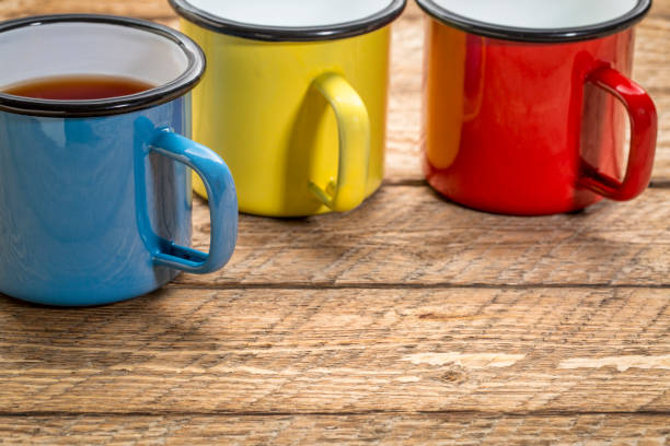 istock metal cups of hot tea on a rustic picnic table 946961218
