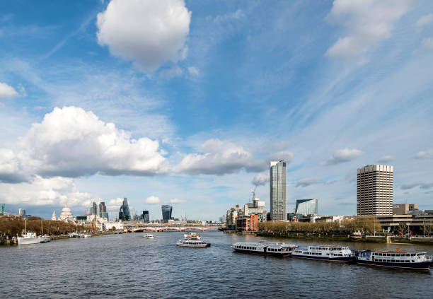 istock Beautiful landscape image view from Waterloo bridge along River Thames towards financial district in London 946964990