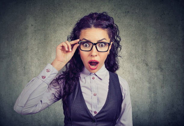 istock Shocked woman in glasses looking at camera 946965084