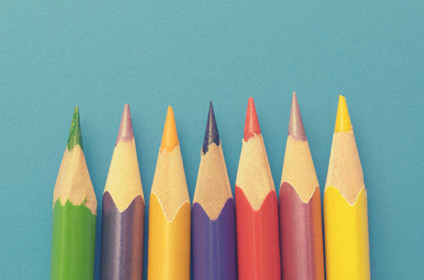 istock Colorful ground pencils group on a blue background. 946965116