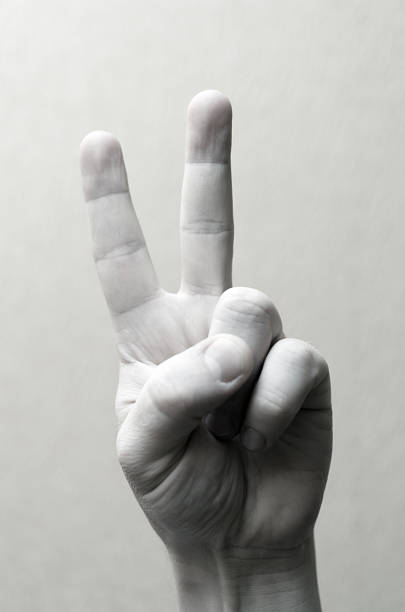 istock Gesture with two fingers up. Black and white image. 946965222