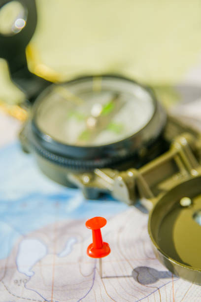 istock Set of map, red push pin and compass for successful traveler 946969628