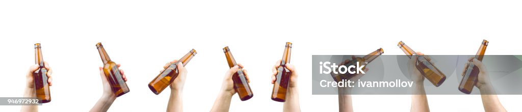 Hands Holding Bottles Of Beer Bunch Of Hands Holding Bottles Of Beer Up At Party Giving A Cheers Isolated On White Background Beer - Alcohol Stock Photo