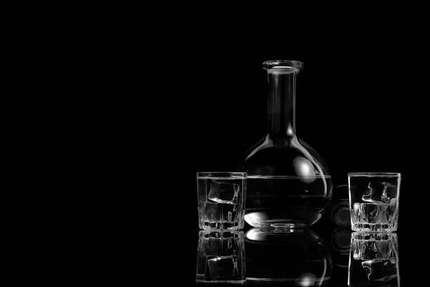 istock Two glasses and a decanter with vodka 946976702