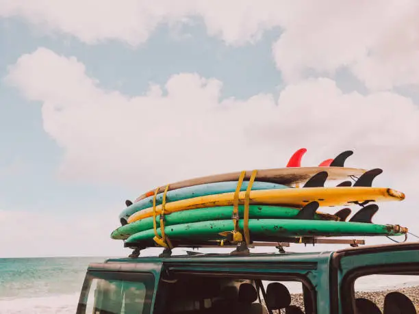 Stack of surfboards on a van roof // mobile stock photo, made with iPhone 8