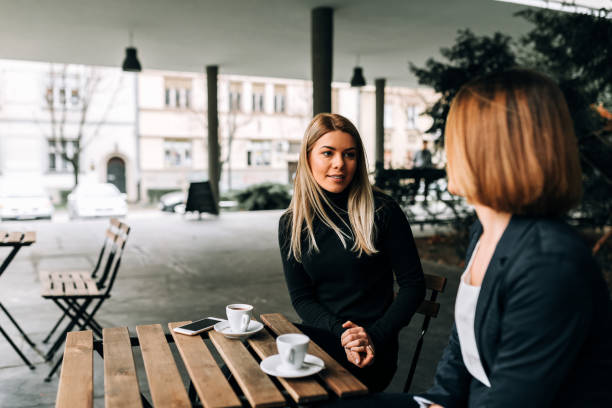 istock Two businesswoman having a coffee break. 946980240
